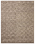 The Alina Rug - Bark by Loloi is a hand-woven, rectangular rug with a subtle mottled beige and brown pattern, finished with a darker brown border.