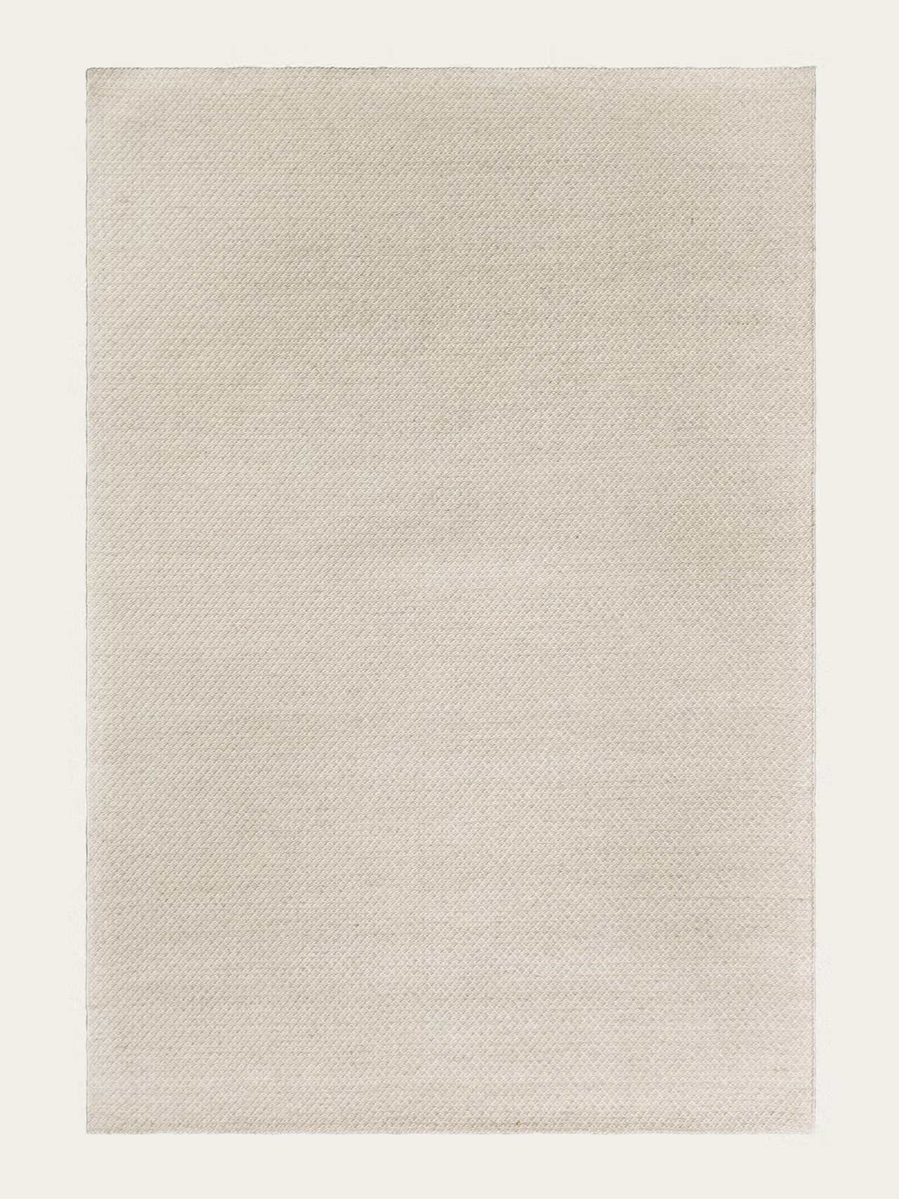 Introducing the Sherpa Rug – Sand by Armadillo&Co: a rectangular, plain light beige Fair Trade rug featuring a subtle woven texture. Expertly handwoven from wool, it’s shown here on a neutral background.