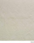 Material Swatches in Alabama Leche, an off-white leather with a textured grain from the Danish Collection.