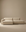 The Wooden Stories Baker Modular Sofa | Fabric • M4 showcases wide, low-profile cushions and an attached chaise in beige, blending seamlessly with a matching beige wall and floor for a modern, minimalist look.