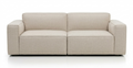 The Baker Sofa | Fabric by Wooden Stories is a modern, light beige Danish sofa with clean lines, wide armrests, and a low backrest, offering supportive comfort against a plain white background.