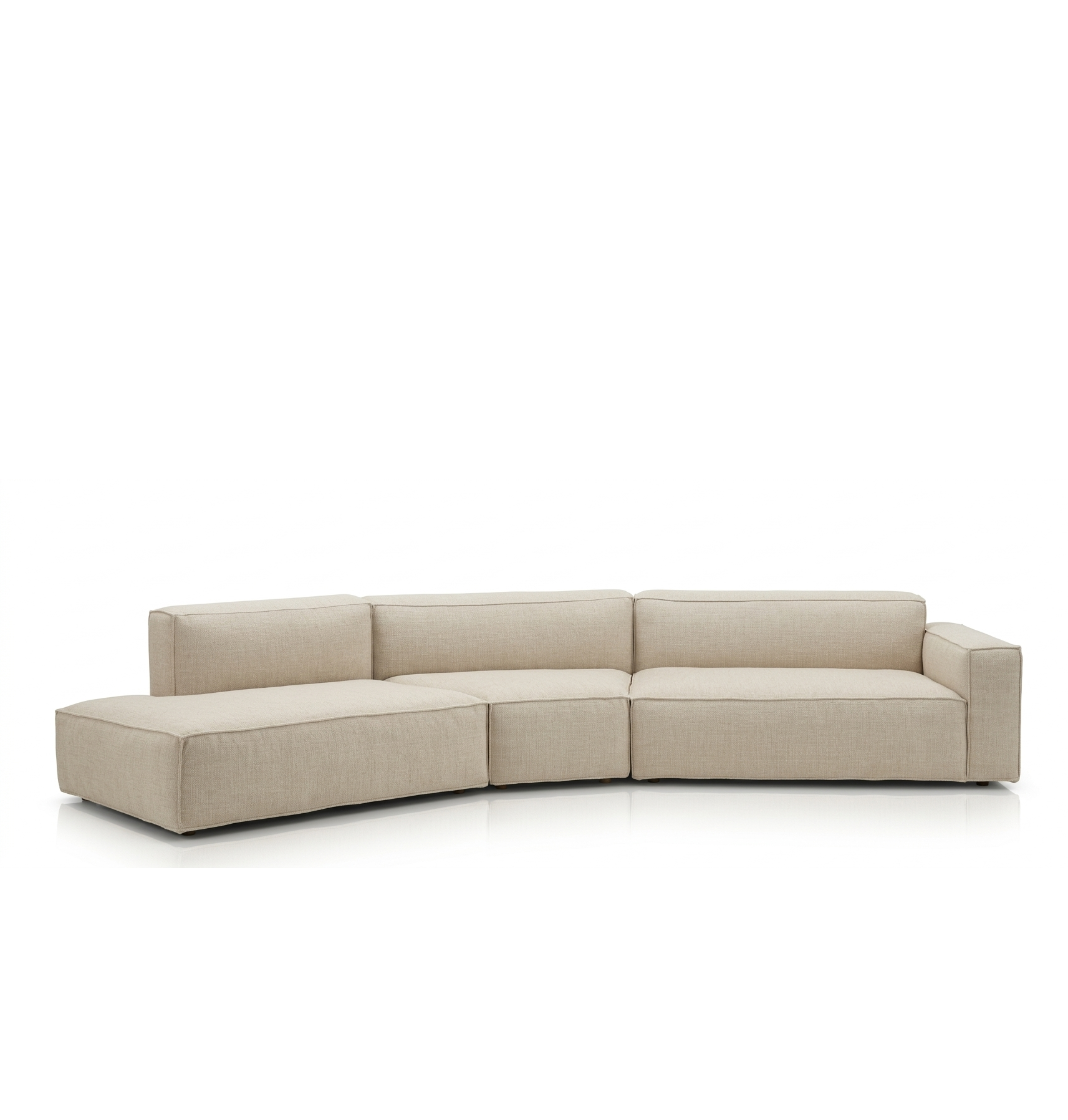 The Baker Modular Sofa | Fabric • M9 by Wooden Stories is a modern beige sectional with clean lines, low backrests, and a left-side chaise lounge, inspired by Danish design and set against a plain white background.