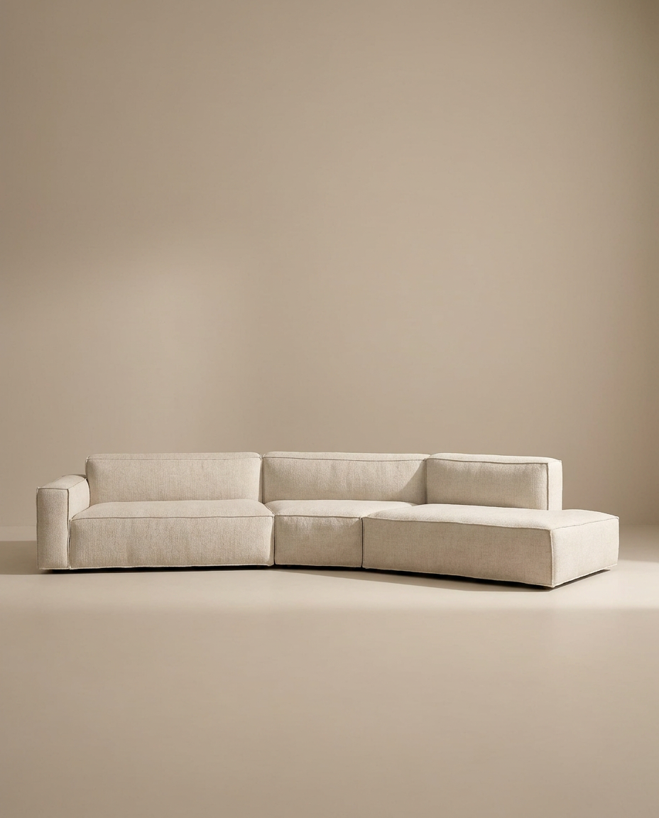 The Wooden Stories Baker Modular Sofa | Fabric • M9 is a modern, light beige sectional with clean lines and a right-side chaise, showcased against a plain, neutral background.