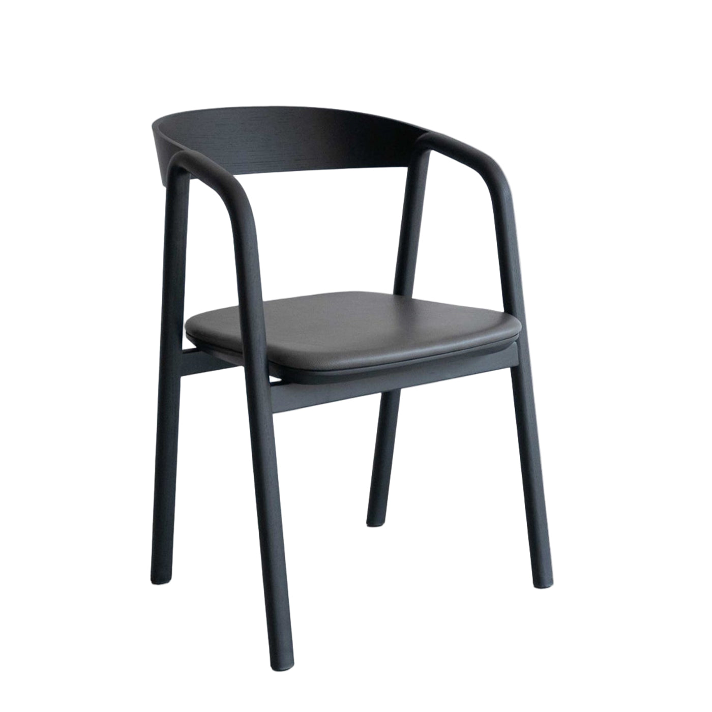 The Inlay Dining Chair by Wooden Stories features a curved backrest, rounded armrests, solid black oak legs, and a flat leather seat, blending minimalist and contemporary Danish style.