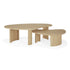Two Ethnicraft Boomerang Coffee Tables in oak feature fluted, curved legs and rounded tops. Their light natural wood finish and overlapping design create a striking minimalist look inspired by classic European style.