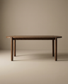 The Wooden Stories Cove Dining Table | Espresso Oak is a simple, modern piece made from solid American oak with rounded edges and cylindrical legs, shown against a plain beige background.