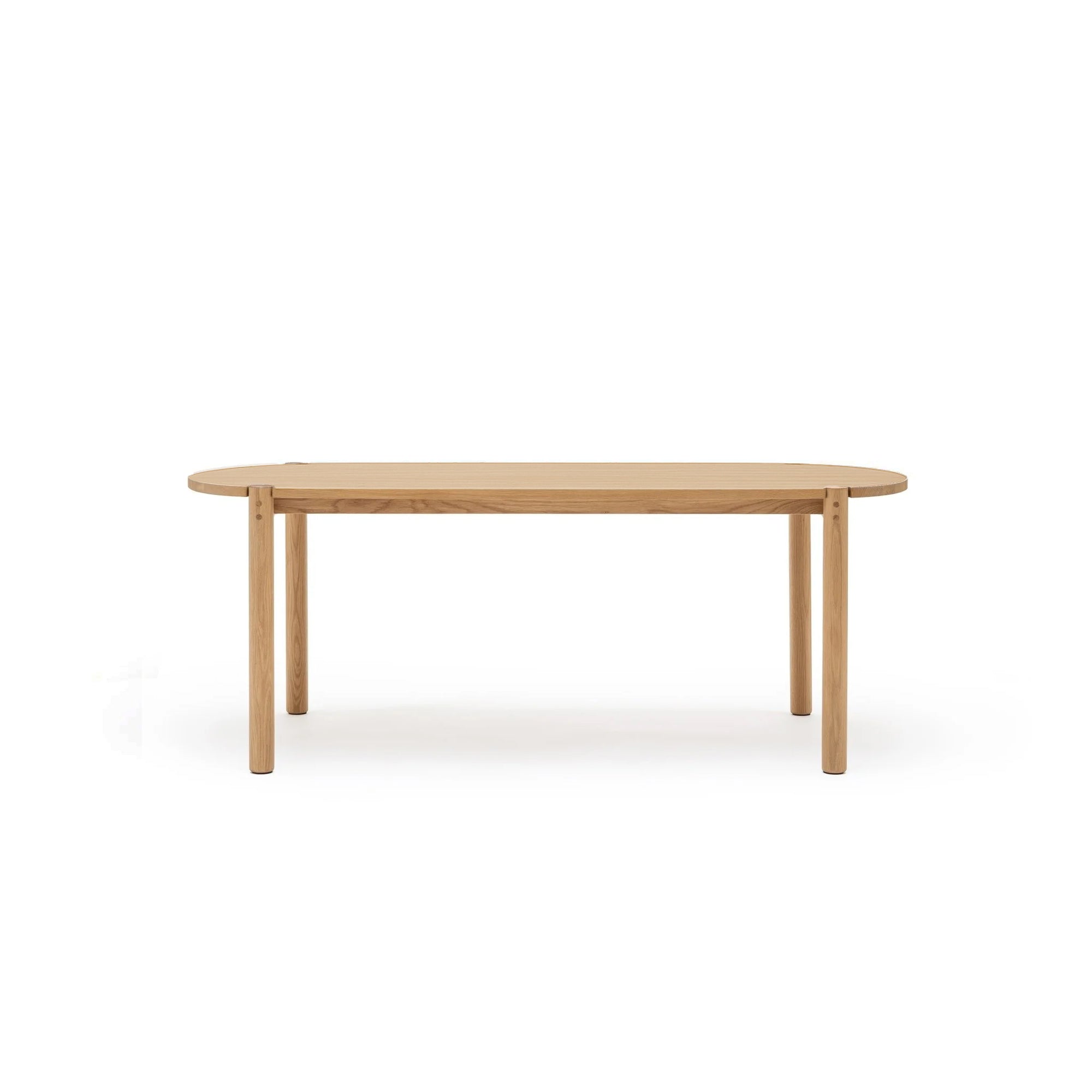 The Cove Dining Table | Light Oak by Wooden Stories is a simple rectangular table made from solid American oak, featuring rounded corners and four straight legs, shown against a plain white background.