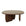 The Eden Coffee Table - Espresso Oak by Wooden Stories features a smooth round top and three wide, curved supports in a rich brown finish, blending modern minimalist style with organic elements for a natural, contemporary look.