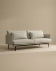 The SOBU Cherry Sofa | Fabric is a modern 3-seater with Danish lines, light gray upholstery, dual seat cushions, and slim black metal legs—ideal for contemporary living spaces against a neutral beige backdrop.