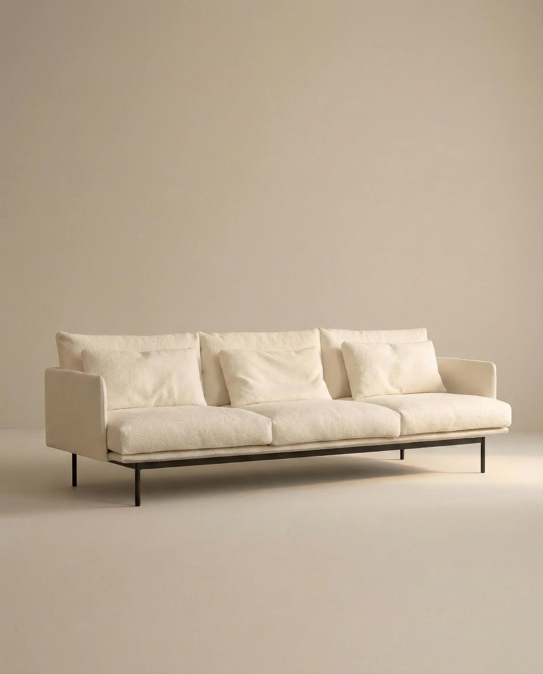 The SOBU Cherry Sofa | Fabric is a modern, minimalist 3-seater with Danish lines and slim black legs, shown with three seat cushions against a plain beige background—ideal for contemporary spaces.