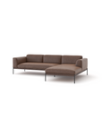 The Department Modular Sofa | Leather • M2 by Wooden Stories is a brown L-shaped sectional with three seat cushions, a right chaise lounge, low backrests, and slim black metal legs, inspired by Danish collections and set against a plain white background.