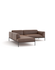 The Department Modular Sofa | Leather • M5 by Wooden Stories is a modern L-shaped brown sectional with wide armrests, low backrests, thin black metal legs, and a solid wood base, shown against a white background.