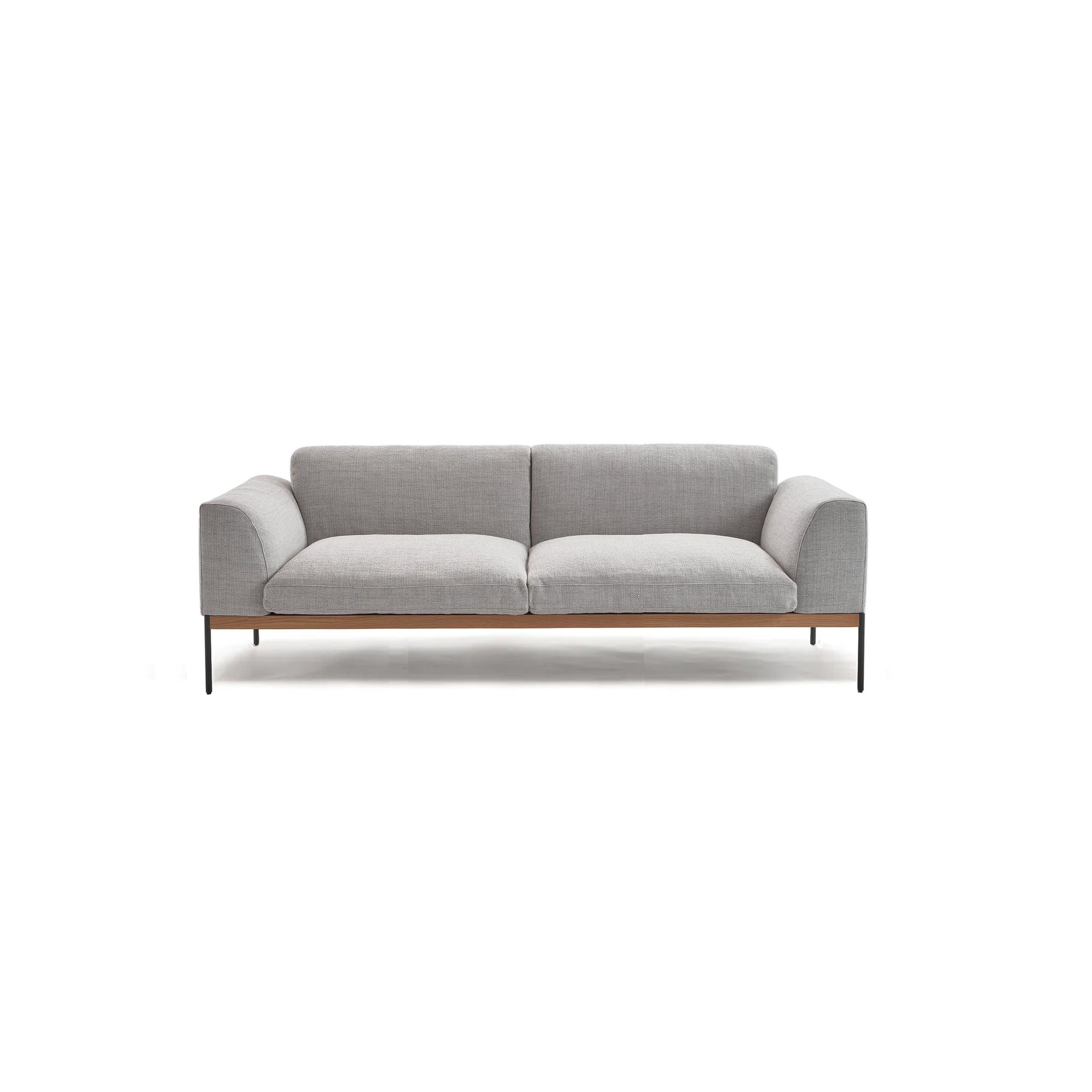 The Department Sofa | Fabric by Wooden Stories features a modern, minimalist Scandinavian design in gray with a low profile, wooden base, and slim black metal legs, shown against a plain white background.