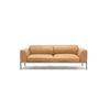 The Department Sofa | Leather by Wooden Stories is a tan leather sofa with wide arms, metal legs, a solid wood base, and a minimalist modern design, shown against a plain white background.