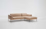 The Wooden Stories Department Modular Sofa | Leather • M1 Right is a modern beige L-shaped sectional with minimalist metal legs and low backrests, shown against a plain white background.
