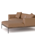 The Department Modular Sofa | Leather • M3 Right by Wooden Stories is a modern brown leather chaise lounge with two matching cushions, a solid wood base, and slim black metal legs, shown on a white background.
