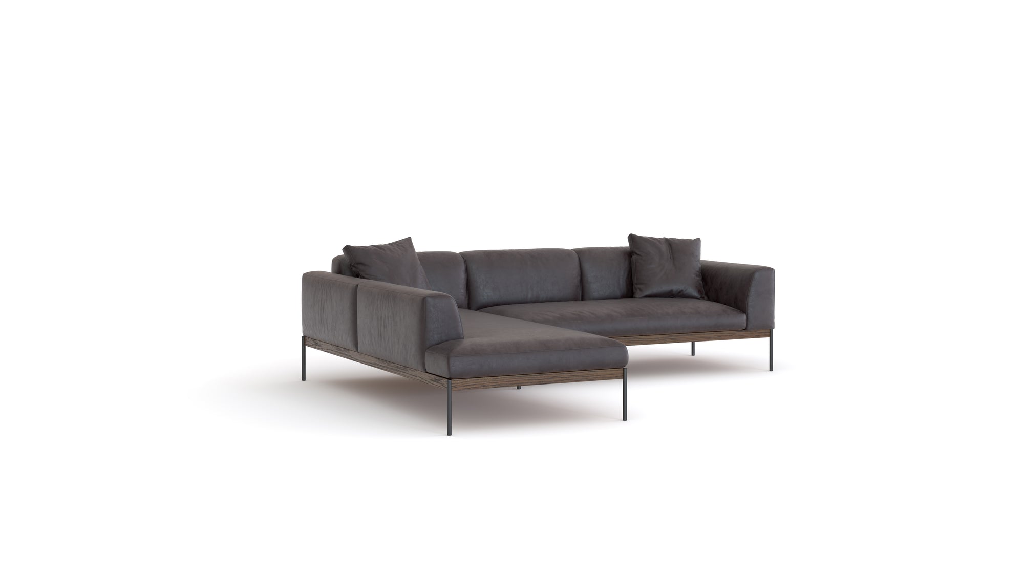 The Wooden Stories Department Modular Sofa | Leather • M4 Left features a modern dark gray design, solid wood base, slim metal legs, a left chaise lounge, and two matching throw pillows, shown against a plain white background.