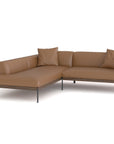 The Department Modular Sofa | Leather • M5 Left by Wooden Stories is a brown L-shaped sectional with three matching cushions and slim black metal legs, featuring Danish-inspired design, shown on a white background.