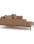The Department Modular Sofa | Leather • M5 Left by Wooden Stories is a modern brown leather sectional with metal legs, a solid wood base, two seat cushions, and matching back pillows, displayed against a white background.