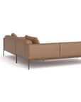 The Wooden Stories Department Modular Sofa | Leather • M5 Left features a modern brown leather design, metal legs, three back cushions, and a solid wood base inspired by Danish collections, shown from the back and side against a white background.