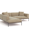 The Wooden Stories Department Modular Sofa | Fabric • M5 Left is a modern L-shaped beige sectional with a solid wood base, metal legs, and three matching cushions, shown on a white background.