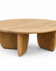 The Eden Coffee Table | Light Oak by Wooden Stories showcases Scandinavian simplicity with its solid wood build, smooth round top, and three curved legs, set against a plain white background.