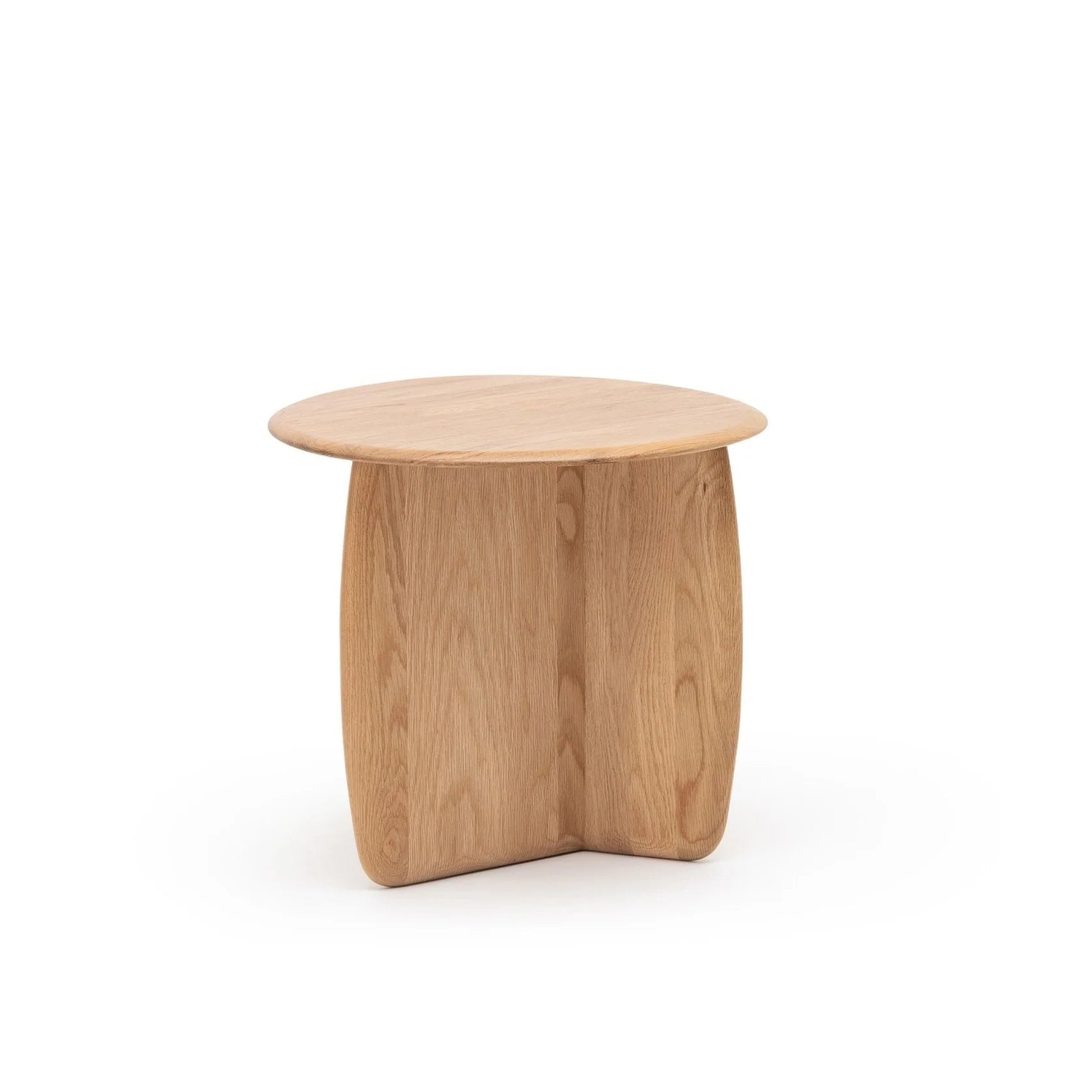 The Eden Side Table by Wooden Stories features a small, round solid American oak top and two intersecting curved legs, showcasing Scandinavian simplicity and modern minimalist design. Displayed against a plain white background.