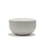 The Wooden Stories Fable Ottoman | Fabric features a round, light gray design with a smooth, curved shape and flat top, inspired by Danish furniture, shown against a plain white background.