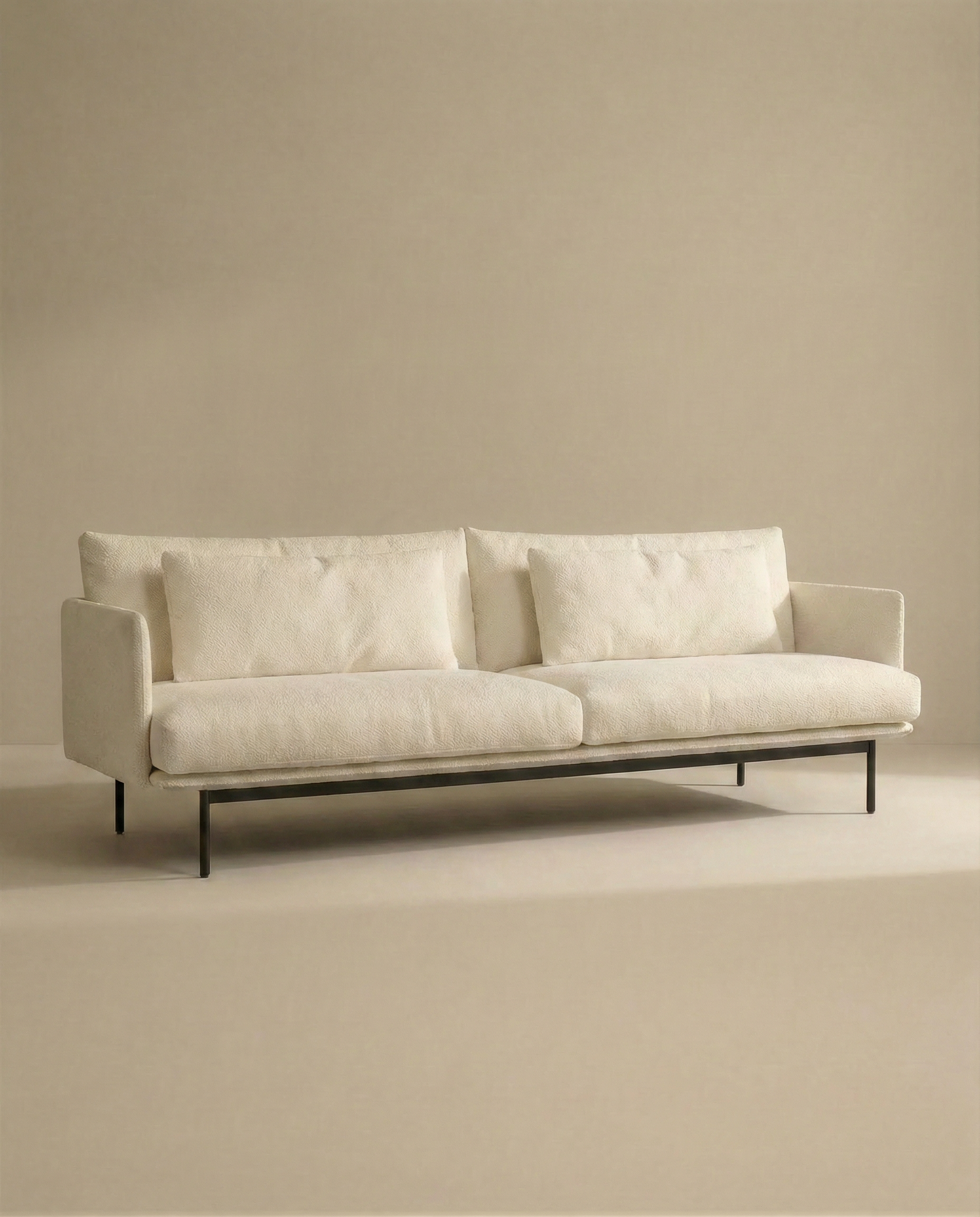 The SOBU Cherry Sofa | Fabric is a modern, minimalist 3-seater in cream with Danish-inspired lines, plush cushions, and slim black metal legs—perfect for elevating any contemporary living space.