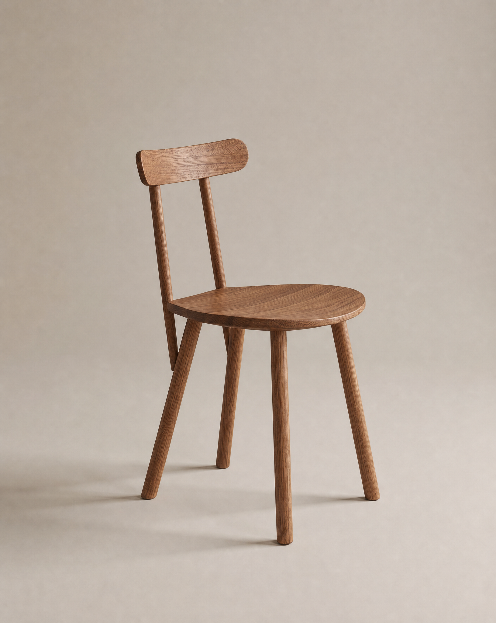 The Figura Dining Chair | Latte Oak by Wooden Stories features a simple wooden design with a round seat, straight legs, and a horizontal backrest, set against a neutral beige background.