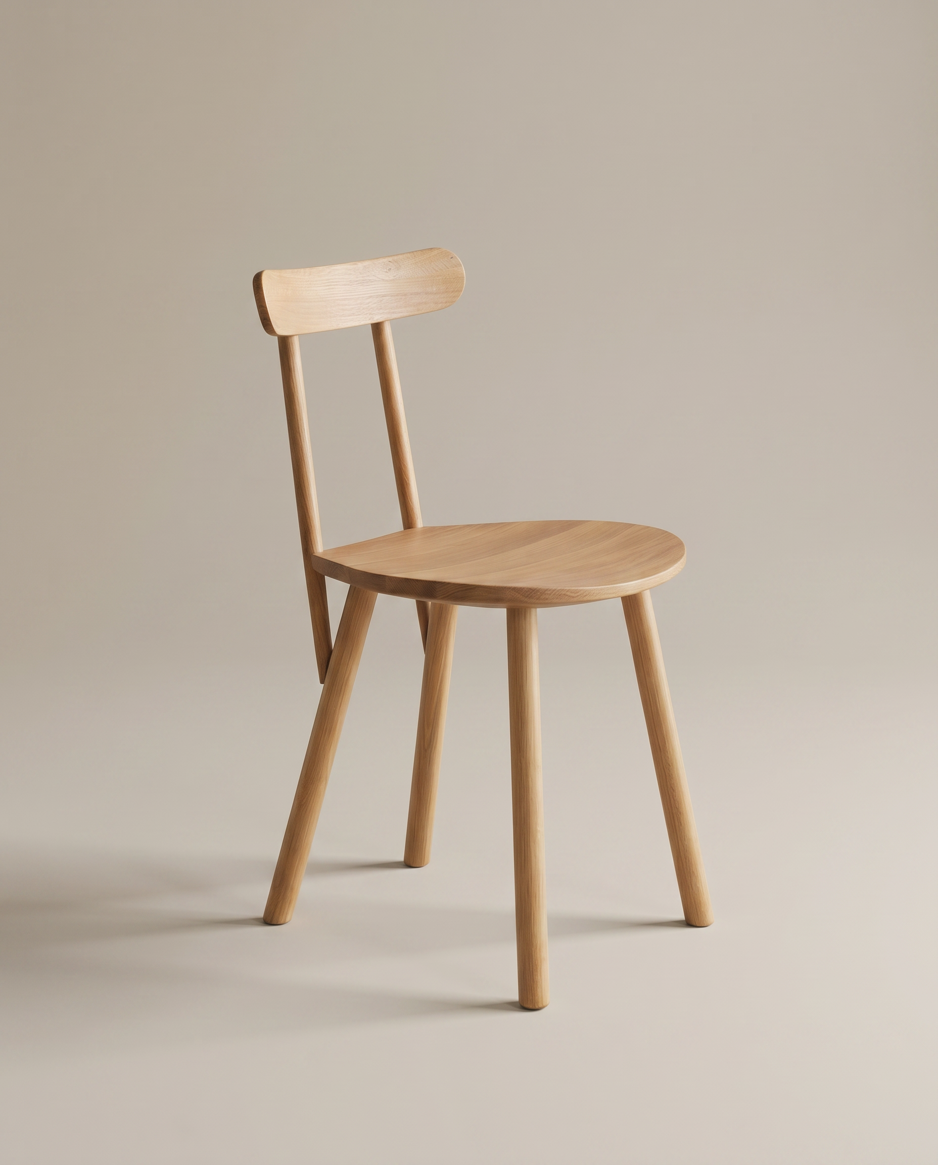 The Figura Dining Chair | Light Oak by Wooden Stories features a simple wooden design with four legs, a round seat, and a straight backrest—showcasing classic Scandinavian style against a light background.