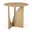 The Ethnicraft Geometric Side Table - Oak features a round solid European oak top, uniquely intersecting flat legs, a natural light wood finish, and a modern minimalist design.