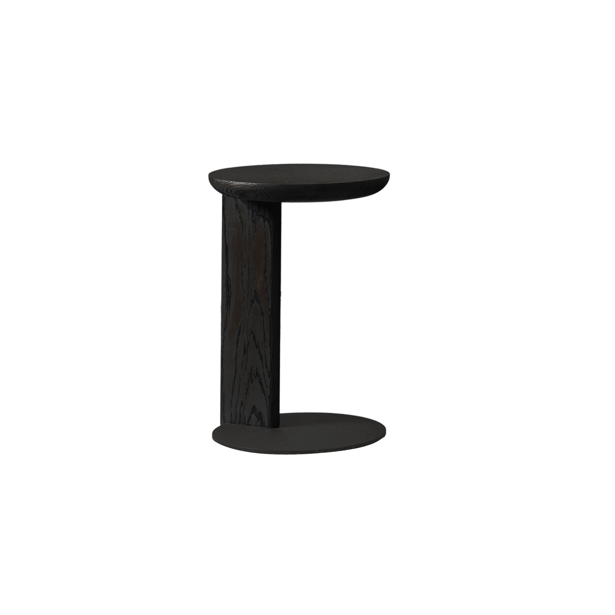 The Wooden Stories Guild Side Table | Black Oak is a small, modern table with a round top, C-shaped design, and sturdy steel base, perfect as a laptop table.
