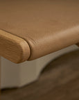 Close-up of the Hover Bench | Leather Seat by Wooden Stories shows a smooth tan leather seat, rounded edges, and natural wood grain, highlighting the elegant craftsmanship and contract grade quality.