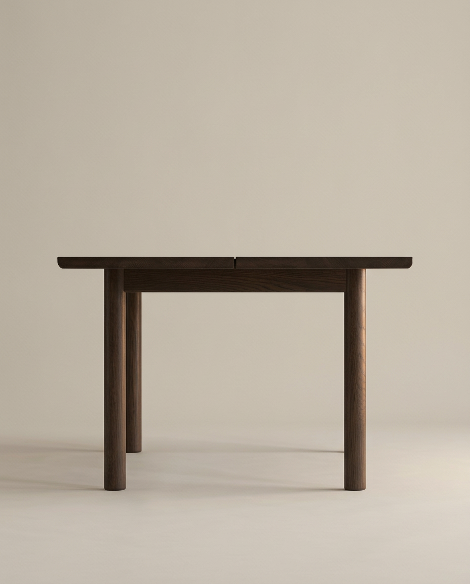 The Itamae Dining Table | Espresso Oak by Wooden Stories features a minimalist, flat rectangular top with four round legs in solid American Oak, inspired by Scandinavian design and shown against a plain beige background.