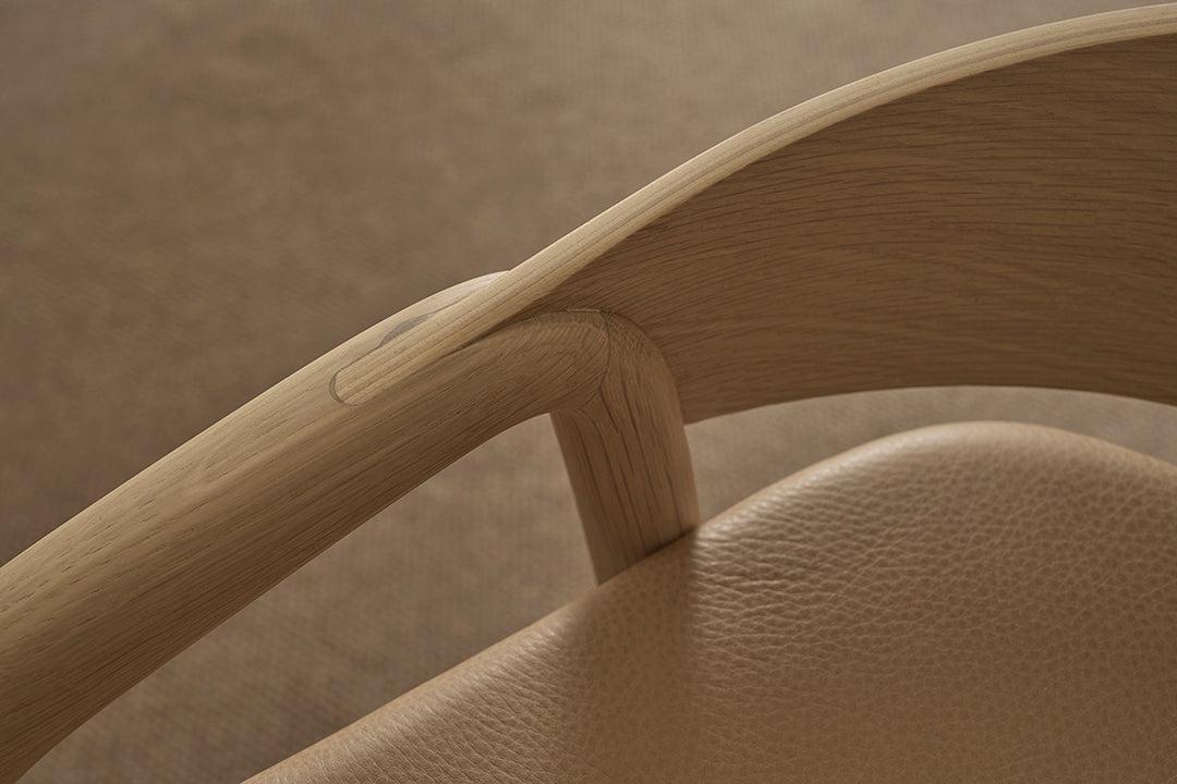 A close-up of the Inlay Counter Stool | Leather Seat by Wooden Stories, crafted from solid oak and inspired by the Danish Collection.