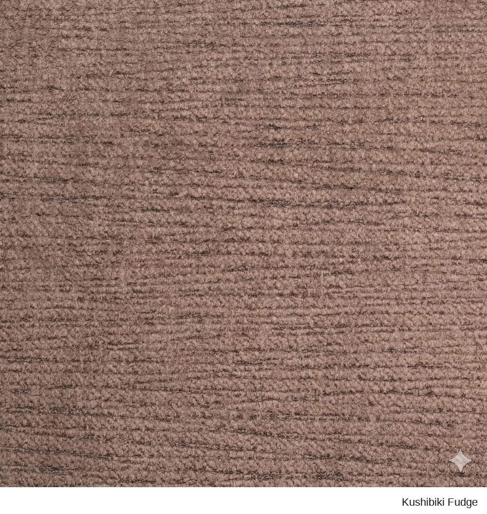 Close-up of a Material Swatches Kushibiki Fudge woven fabric swatch from the Danish Collection, featuring a textured, light brown surface.