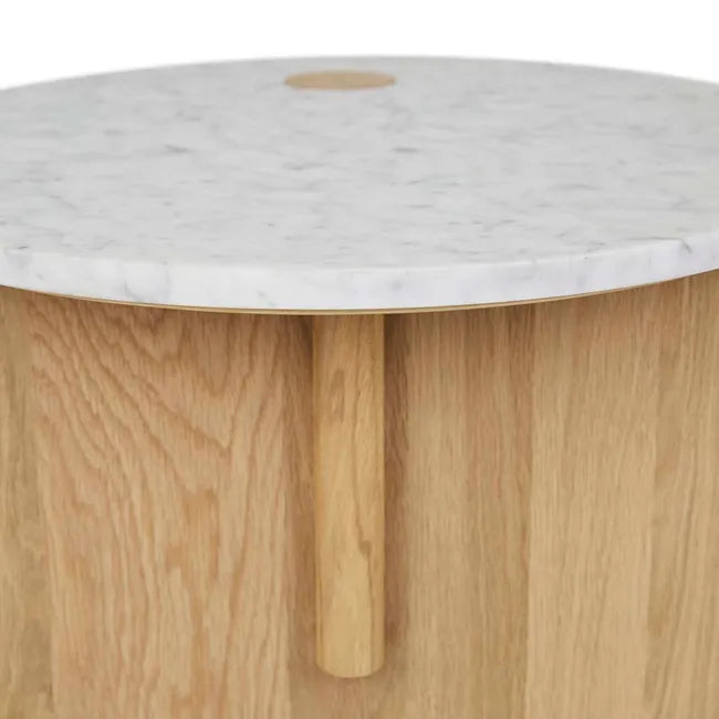 The Pivot Side Table | Light Oak by Wooden Stories features modern Danish design with a light solid oak base, a smooth white marble top, and a small circular wooden accent near the edge.