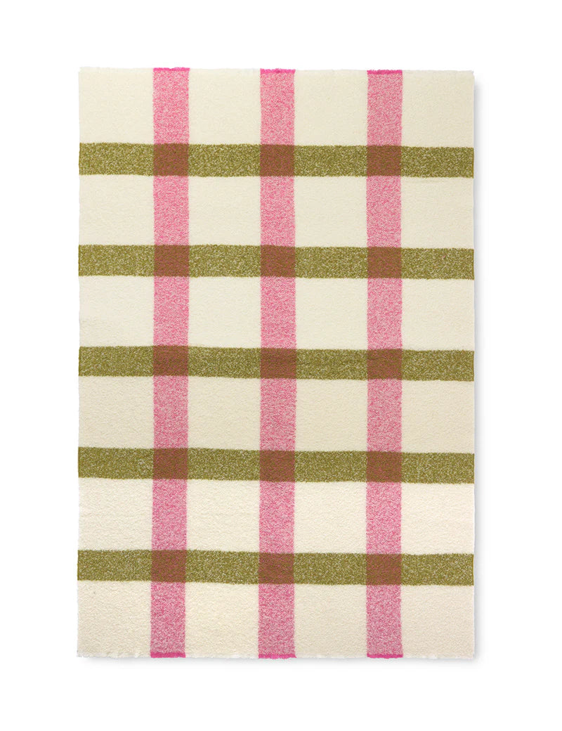 The Elvang Denmark Lava Throw - Pink features an off-white background with a plaid pattern of olive green and pink stripes, inspired by Scandinavian blankets and creating a grid with alternating colors.