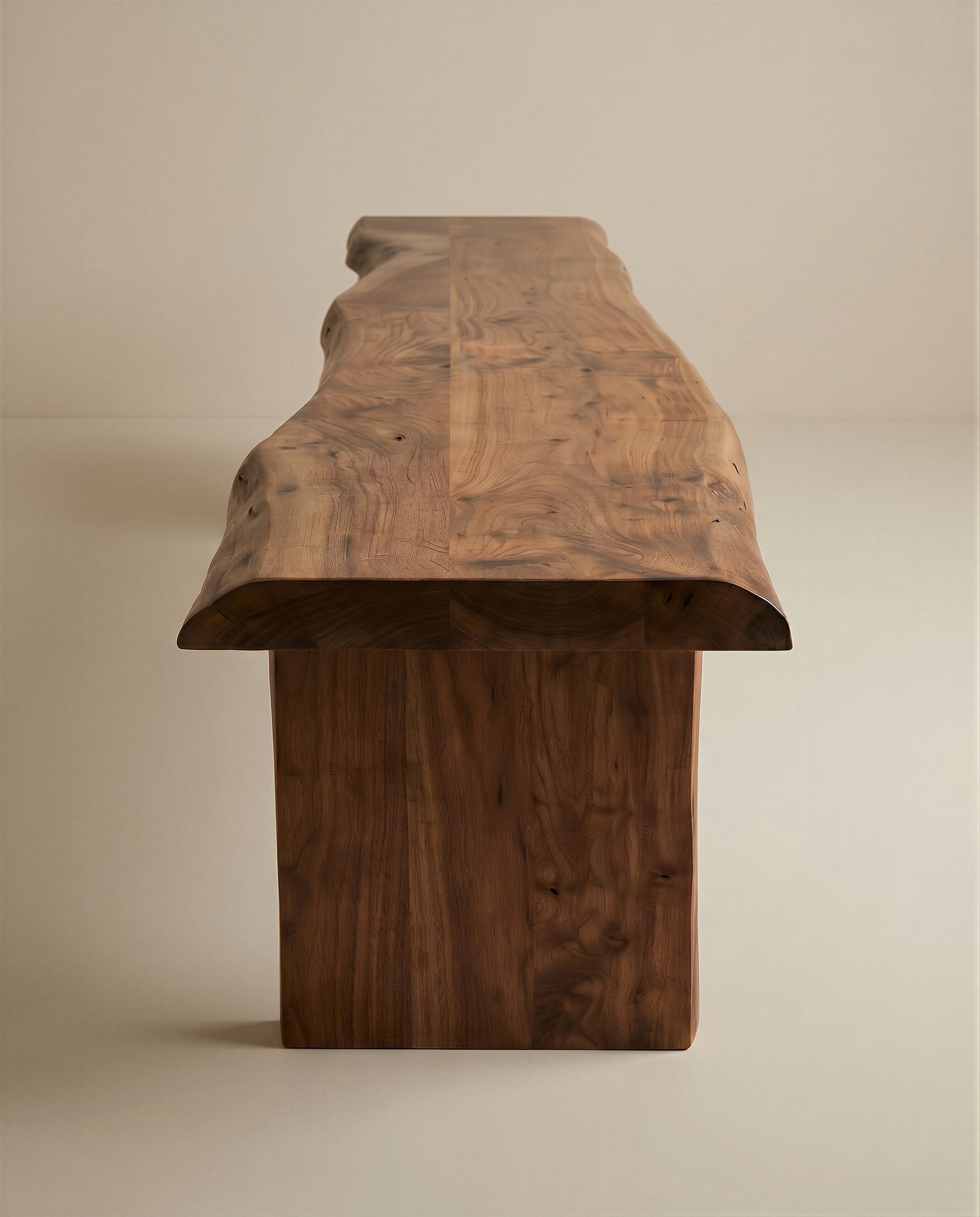 The SOBU Leviathan Live Edge Bench - Wood Legs, featuring a smooth finish and organic wood grain, is displayed against a light background. Its natural silhouette stands out from the Leviathan Collection.