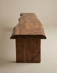 The SOBU Leviathan Live Edge Bench - Wood Legs, featuring a smooth finish and organic wood grain, is displayed against a light background. Its natural silhouette stands out from the Leviathan Collection.