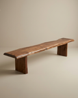 The SOBU Leviathan Live Edge Bench - Wood Legs showcases a natural acacia slab seat with visible grain and block legs, making it a perfect rustic accent for minimalist beige spaces. Custom length offers tailored elegance.
