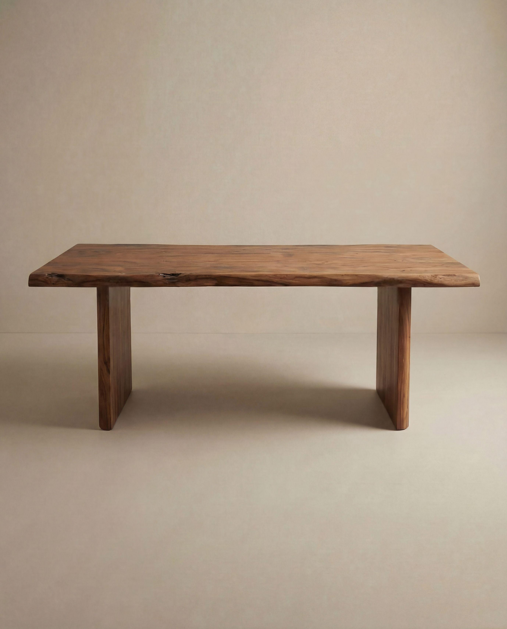 The SOBU Leviathan Live Edge Dining Table features a solid acacia top with a natural finish, thick wood legs, and a smooth, slightly irregular surface, shown against a plain beige background.