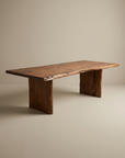 The SOBU Leviathan Live Edge Dining Table features a large, rectangular solid acacia top with natural live edges and two wide wooden legs, shown against a plain, neutral background.