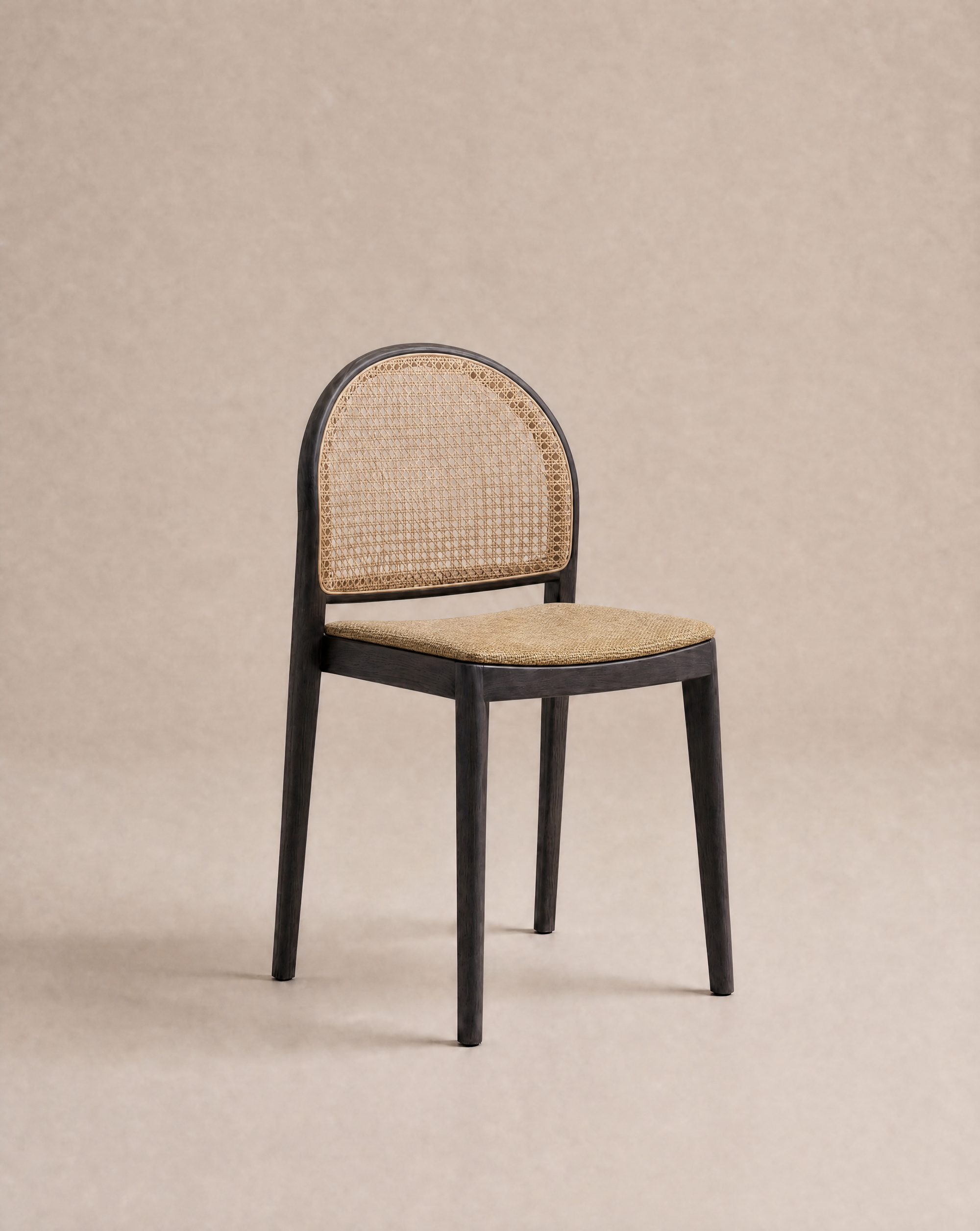 The Luk Dining Chair | Fabric Seat by Wooden Stories, featuring a dark wood frame and fabric seat, sits against a light brown backdrop, blending contract grade durability with timeless style.