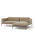 The Wooden Stories Department Modular Sofa | Fabric • M2 features a modern beige design with a right-side chaise, solid wood base, and metal legs, all set against a plain white background.