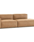 The Baker Modular Sofa | Leather • M1 by Wooden Stories is a modern tan leather loveseat with wide blocky armrests and plush seat and back cushions, shown against a white background.