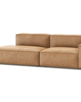 The Wooden Stories Baker Modular Sofa | Leather • M1 is a modern, light brown modular sofa with wide seats, low backs, a left chaise lounge, and right armrest, shown against a plain white background.