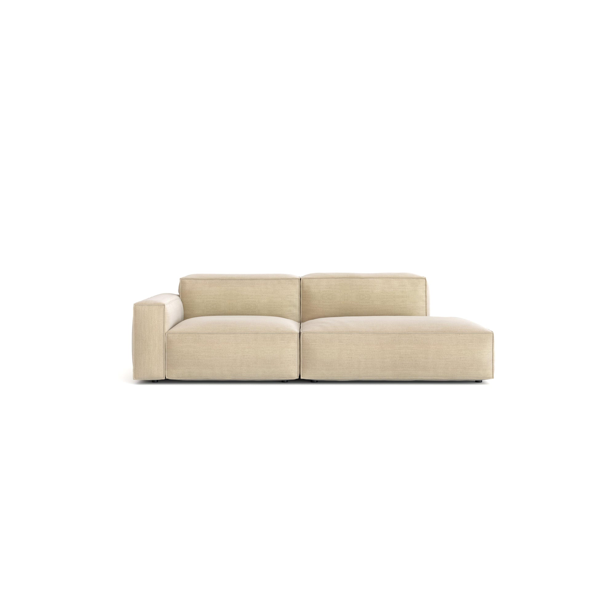 The Baker Modular Sofa | Fabric • M1 by Wooden Stories is a contemporary beige sofa with a left armrest, square cushions, soft feather filling, and a minimalist design, shown against a plain white background.