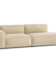 The Baker Modular Sofa | Fabric • M1 by Wooden Stories is a modern beige sofa with feather filling, low backrest, wide cushioned seats, clean lines, and a left-side armrest, shown against a white background.